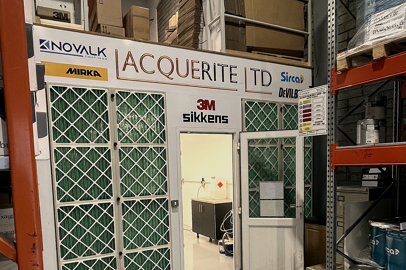 Mixing room entrance branded Lacquerite Ltd, Novalk, Sirca, Mirka, DeVilbiss, 3M and Sikkens